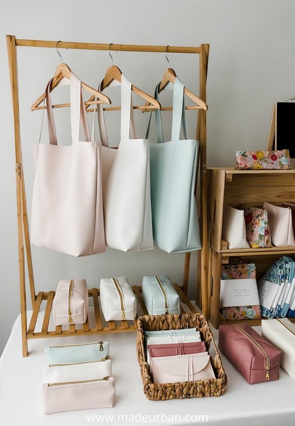 Hanging bags in a craft fair display